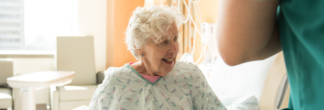 Old Woman in Hospital Gown Smiling | Virginia Mason Institute