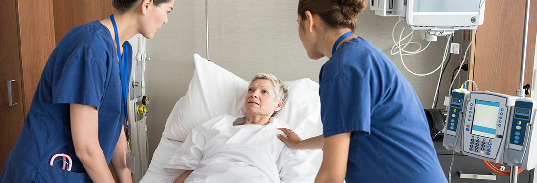 Two nurses taking care of a hospital patient | Virginia Mason Institute