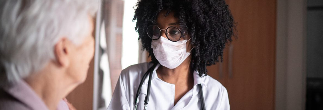 Female Doctor wearing a face mask.