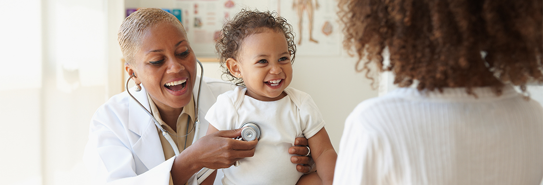 Doctor with stethoscope measuring baby heartbeat | Virginia Mason Institute